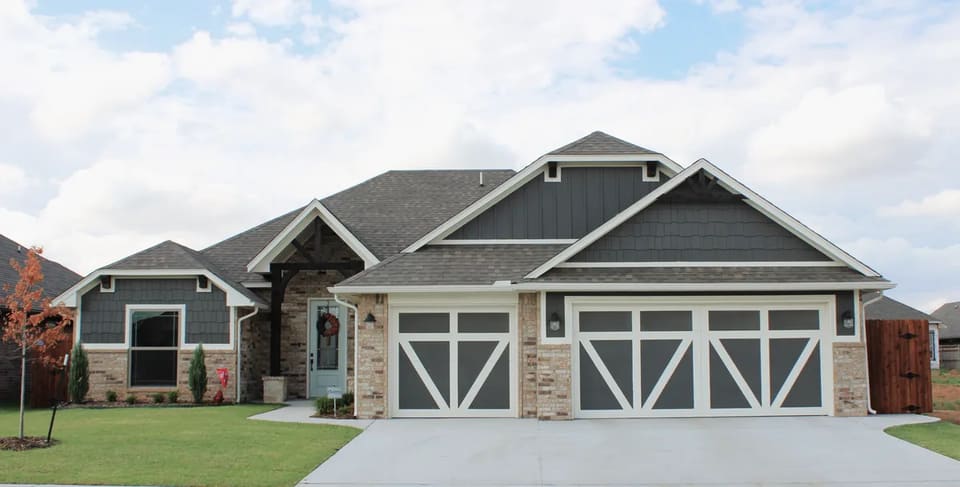 Gray craftsman-style home in Mustang, OK painted by Hometown Painting