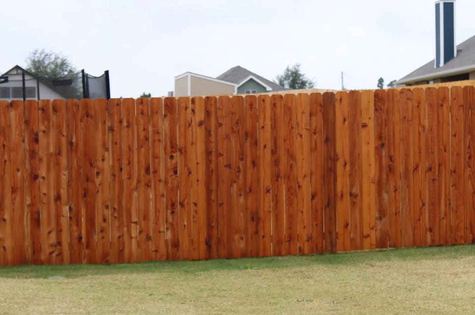 redwood stain on a cedar fence